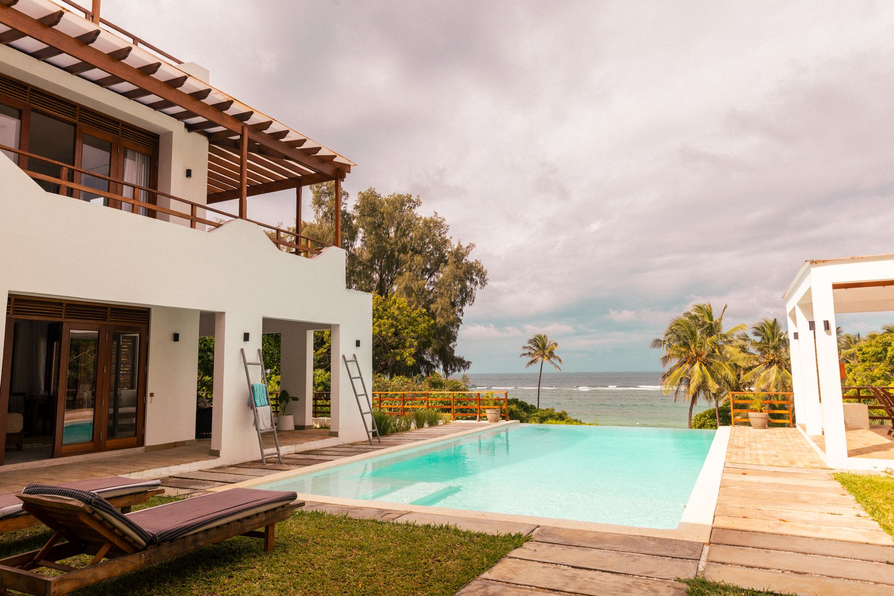 Asili House, its pool and the ocean beyond
